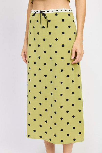 Women’s polka dot midi skirt with lace trim by Jade Icarus, featuring a flowy fabric and classic pattern.