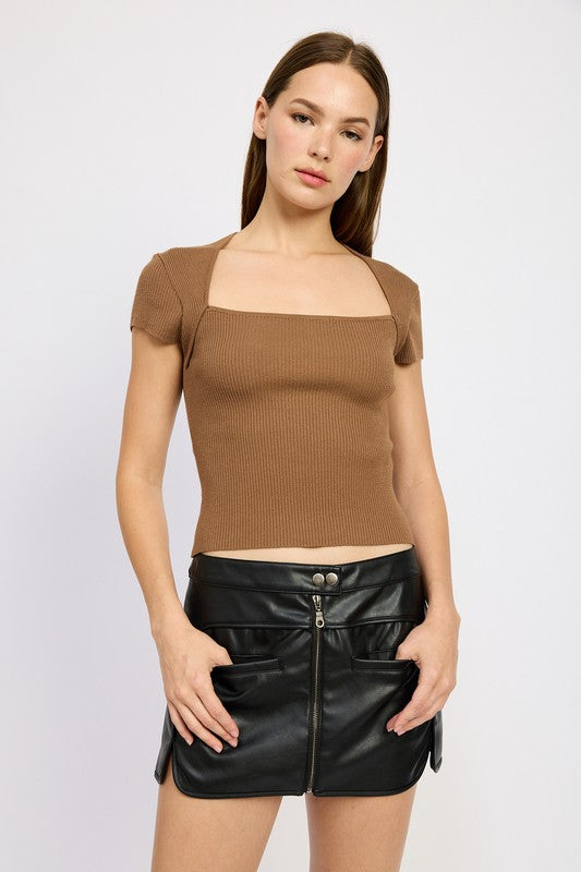 Jade Icarus Moto Mini Skirt with zipper, automotive-inspired design, black fabric with silver zipper detail, close-up view.