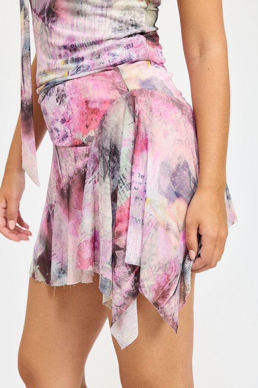Jade Icarus asymmetrical Sharkbite hem mini skirt in automotive style, featuring unique sharkbite hem design and sleek fabric.