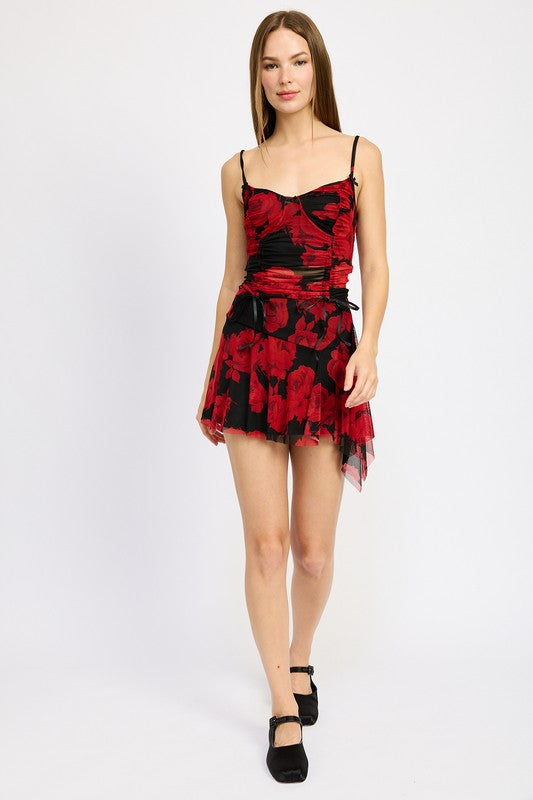 Jade Icarus asymmetrical sharkbite hem mini skirt in automotive-inspired design, showcasing unique hem detail and fabric texture.