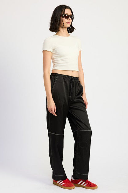 Jade Icarus satin lounge pants with contrasting stitch detail, showcasing smooth fabric and relaxed fit in the automotive style.