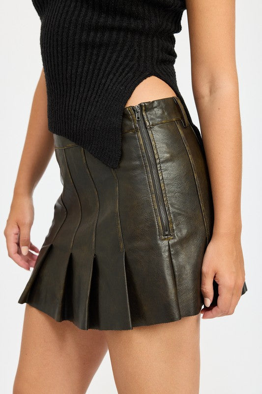 Jade Icarus leather pleated skirt designed for automotive use, featuring sleek, textured leather with pleats and detailed stitching.