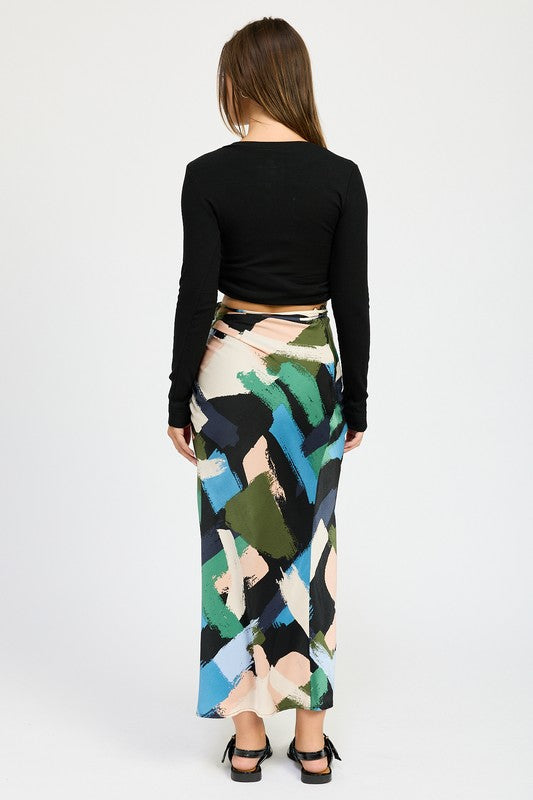 Side ruched midi skirt by Jade Icarus, featuring a stylish automotive-inspired design in a sleek fabric.