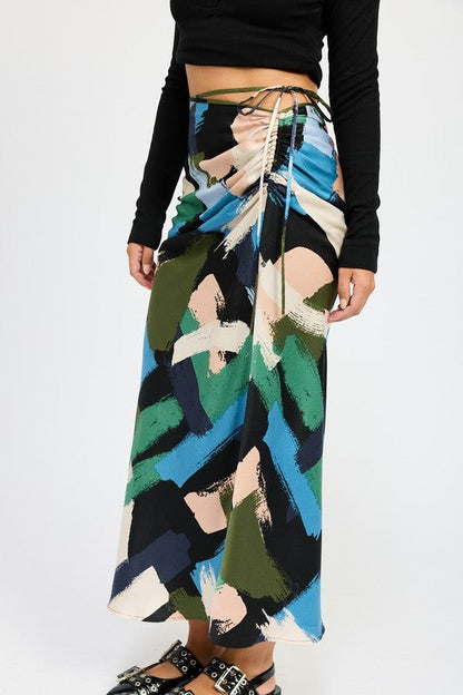 Side ruched midi skirt from Jade Icarus, showcasing fabric detail and ruching design in a automotive-inspired style.