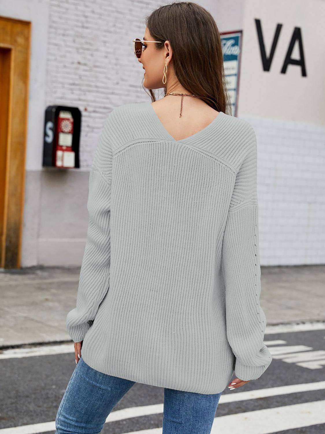 Carmine Juneberry V-neck rib-knit top in soft fabric, featuring a fitted silhouette and short sleeves.