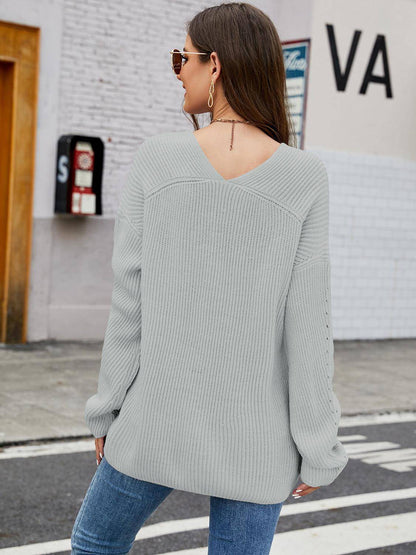 Carmine Juneberry V-neck rib-knit top in soft fabric, featuring a fitted silhouette and short sleeves.