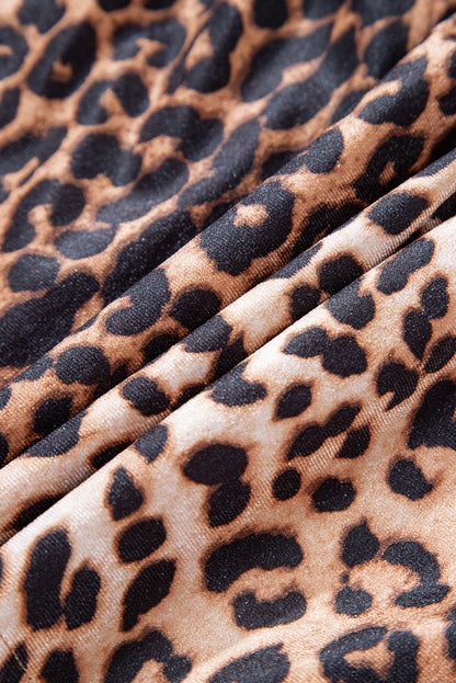 Leopard tiered patchwork mini skirt by Byzantium Bay featuring a stylish, layered design and animal print fabric.