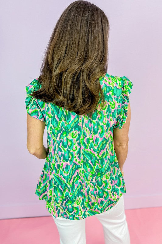 Women’s ruffled trim tied split neck tank top by Jade Icarus, featuring lightweight fabric and stylish design in a close-up shot.