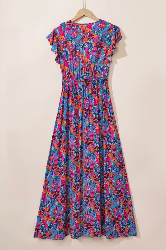 Women’s floral print V-neck wrap split maxi dress by Jade Icarus, featuring a flowy silhouette and vibrant floral pattern.