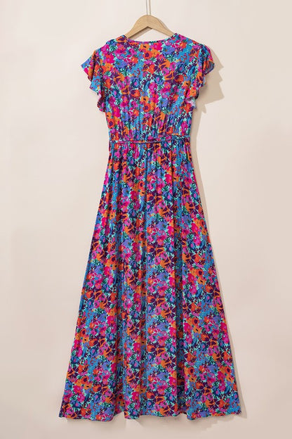 Women’s floral print V-neck wrap split maxi dress by Jade Icarus, featuring a flowy silhouette and vibrant floral pattern.