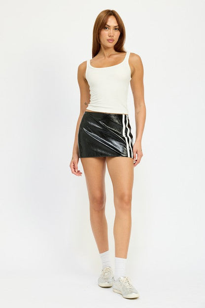 Jade Icarus MINI MOTO leather skirt, showcasing sleek black automotive-inspired design with detailed stitching and modern style.