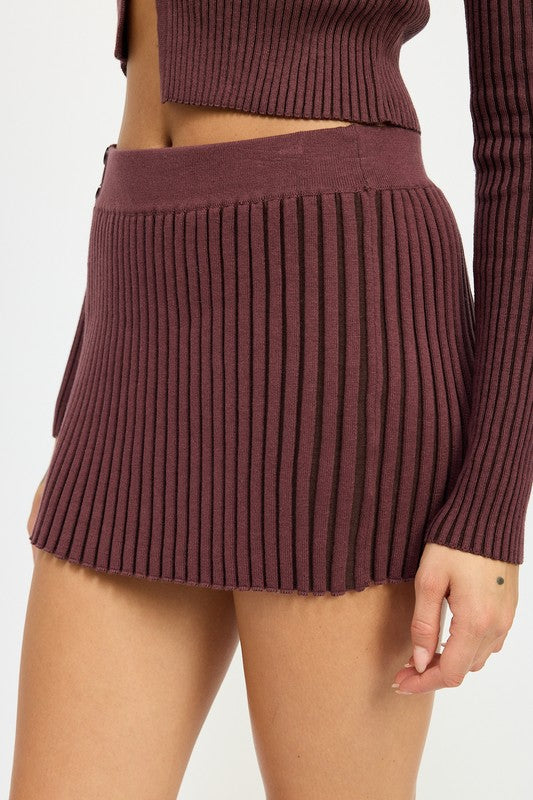 Automotive Jade Icarus ribbed knit mini skirt with textured ribbed pattern, displayed on a neutral background.