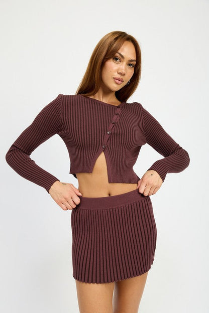 Automotive Jade Icarus ribbed knit mini skirt featuring textured ribbing and fitted style, shown in a close-up image.