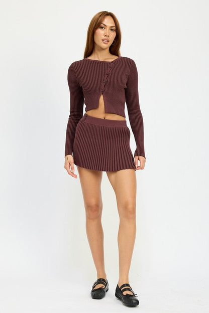 Close-up of Jade Icarus ribbed knit mini skirt featuring textured ribbing and fitted design, shown in a neutral color.