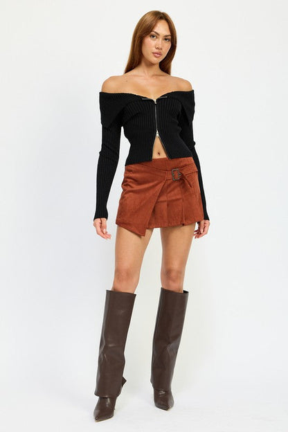 Jade Icarus wrapped buckle belt mini skirt featuring a stylish design and versatile fit, shown on a model.