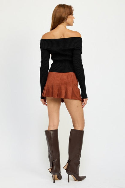 Jade Icarus wrapped buckle belt mini skirt in black fabric, featuring a stylish buckle detail and fitted waist.