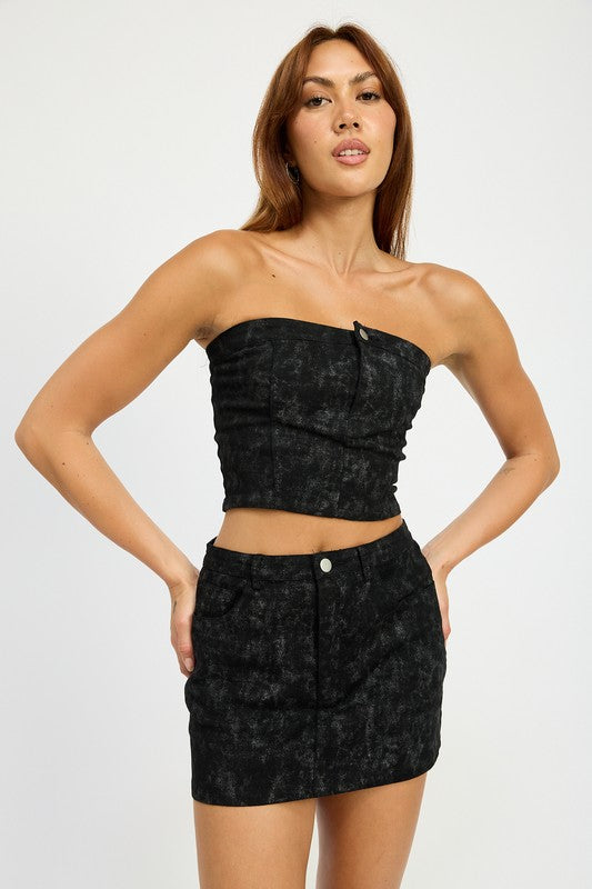 Jade Icarus washed denim print mini skirt with front slit and high waist, casual chic style, shown on a model.