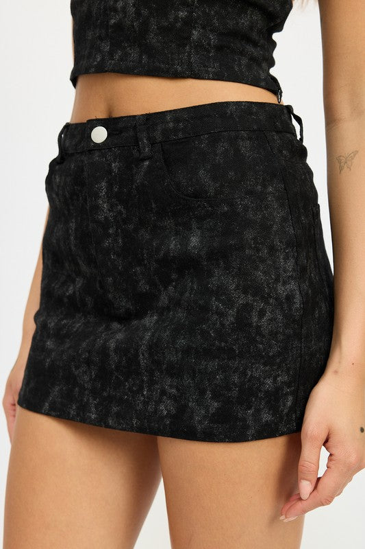 Jade Icarus washed denim print mini skirt with a fitted waist and frayed hem, showcasing a casual denim design.