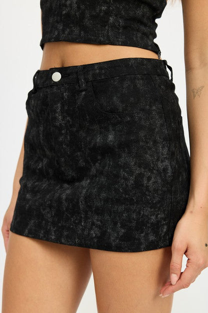 Jade Icarus washed denim print mini skirt with a fitted waist and frayed hem, showcasing a casual denim design.