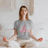 Yellow Pandora yoga meditation pose print T-shirt, casual crewneck shirt with peaceful yoga figure design on soft fabric.