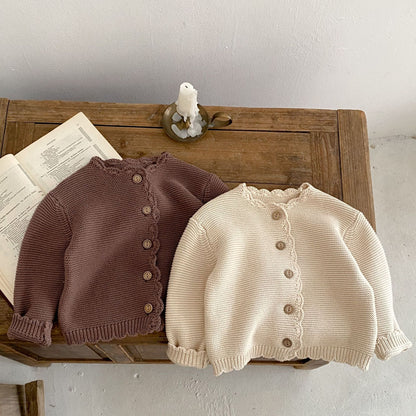 Baby unisex solid color crochet cardigan by Yellow Angel, soft knit sweater for kids and babies, front view of the clothing.