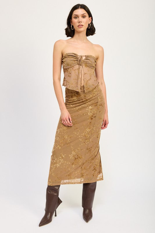 Automotive fitted maxi skirt with slit by Jade Icarus, showcasing sleek fabric and high slit design in a fashion-forward style.