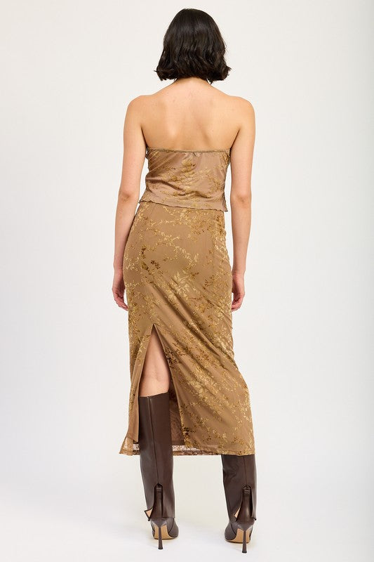 Fitted maxi skirt with slit from Jade Icarus, showcasing smooth fabric and stylish design in a close-up view.