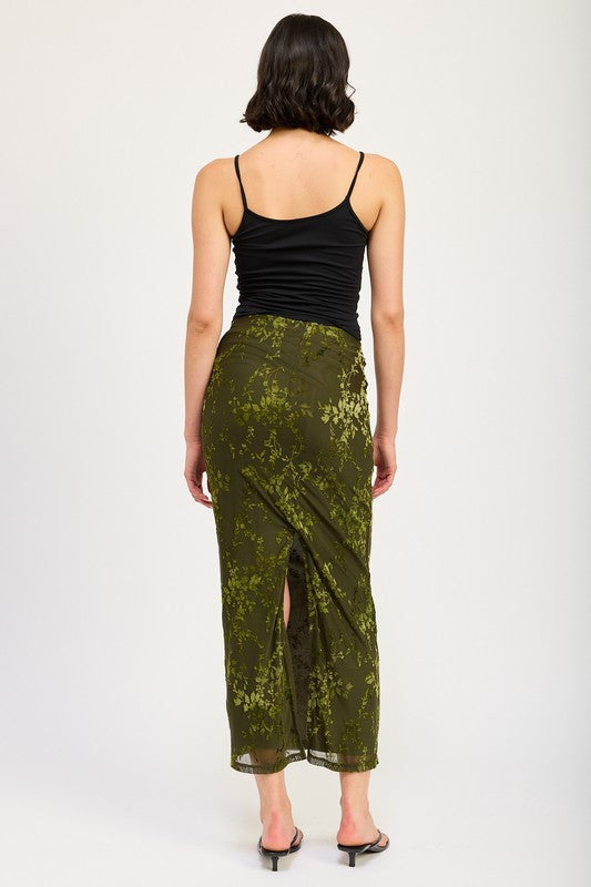 Automotive fitted maxi skirt with slit by Jade Icarus, featuring sleek fabric and stylish design, displayed on a model.