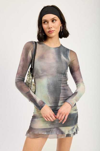 Automotive interior with dashboard and steering wheel, featuring Jade Icarus long sleeve ruffled mini dress with cutout design.