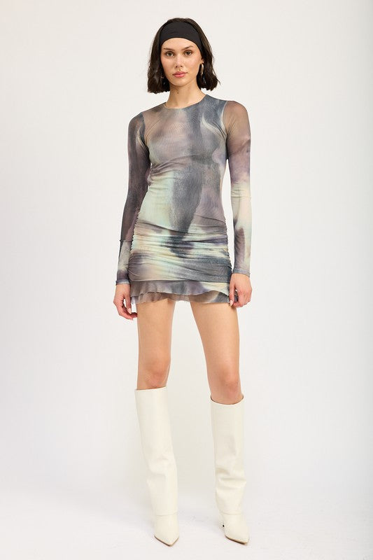 Automotive Jade Icarus long sleeve ruffled mini dress with cutout design, featuring intricate ruffle details and stylish cutouts.