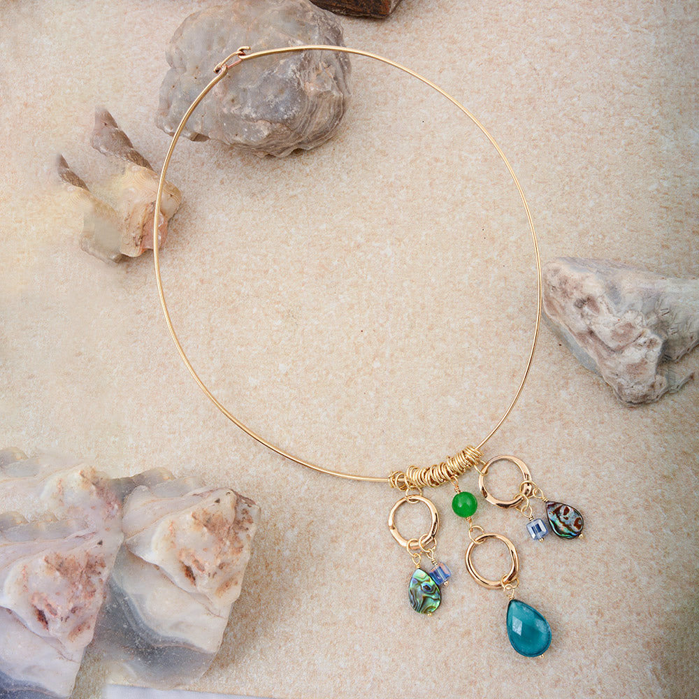 Abalone and green onyx golden collar necklace featuring a polished, elegant design with intricate detailing and a luxurious finish.