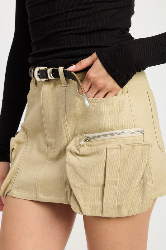 Jade Icarus exposed cargo pocket mini skirt with automotive-inspired design, featuring visible cargo pockets and sleek fabric.