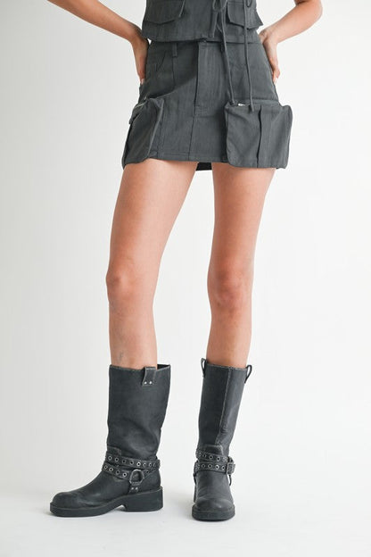 Jade Icarus exposed cargo pocket mini skirt with automotive design, featuring visible cargo pockets and detailed stitching.