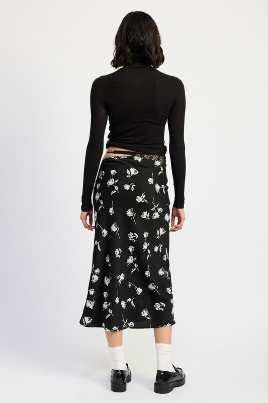 Asymmetrical satin maxi skirt by Jade Icarus featuring mixed media design and flowing silhouette in natural fabric details.