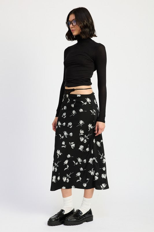 Jade Icarus mix media asymmetrical satin maxi skirt with layered design and flowing fabric, styled with a modern, artistic look.