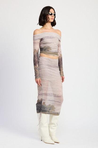 Jade Icarus ruched midi skirt with drawstrings, showcasing its textured fabric and adjustable waist design.