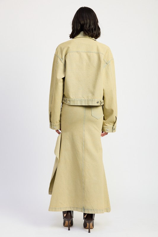 Automotive V-Waistline draped maxi skirt with slit detail by Jade Icarus, featuring flowing fabric and elegant design.