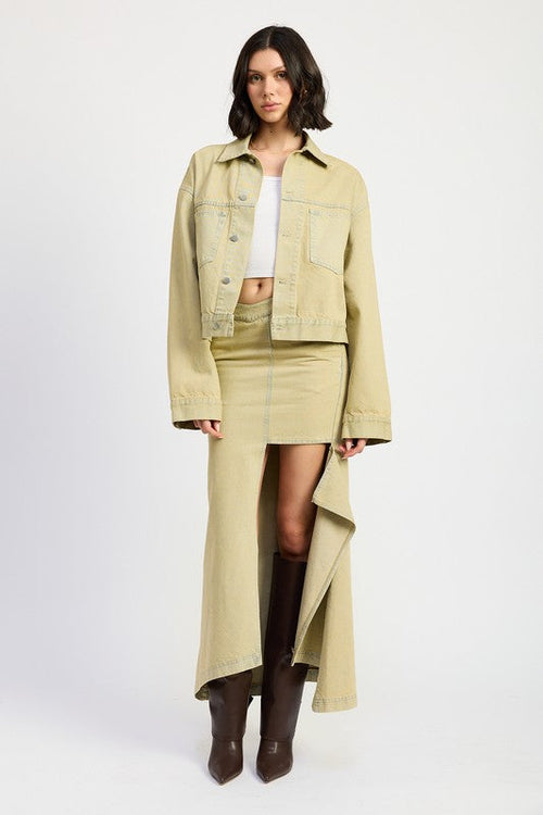 Jade Icarus V-waistline draped maxi skirt with slit detail, showing flowing fabric and elegant design in a fashion photo.