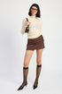 Automotive Jade Icarus mini low waisted skirt with ribbon ties, featuring a sleek design and fashionable details.