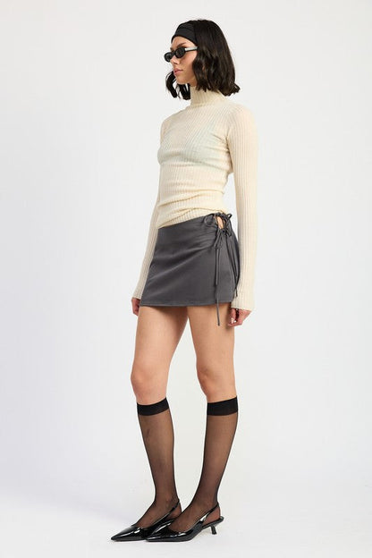 Automotive miniature model of a low-waisted skirt with ribbon ties by Jade Icarus, displayed as a detailed scale replica.