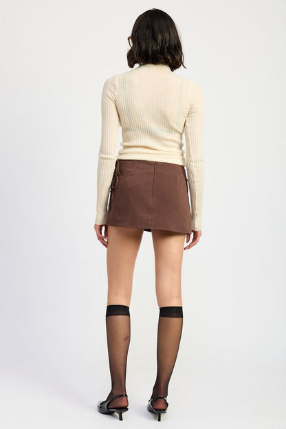 Automotive mini low-waisted skirt with ribbon ties by Jade Icarus, featuring a sleek design and decorative ribbon accents.