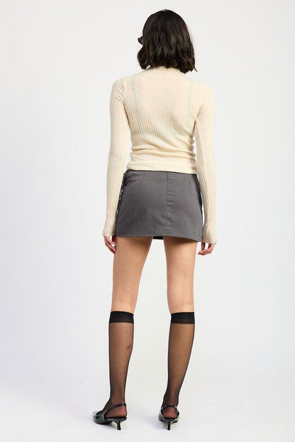 Automotive Jade Icarus mini low-waisted skirt with ribbon ties, featuring a sleek design and stylish details.