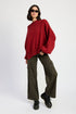 Jade Icarus mid-rise wide-leg cargo pants with large side pockets and relaxed fit, shown on a model.