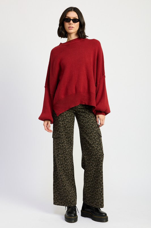 Jade Icarus mid-rise wide leg cargo pants with large side pockets and relaxed fit, shown on a model.