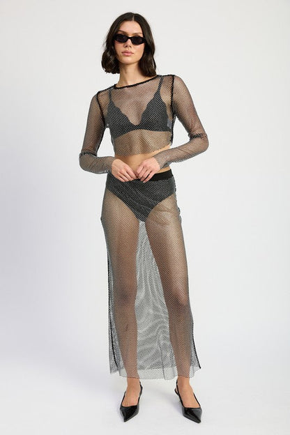 Sheer rhinestone maxi skirt by Jade Icarus with intricate rhinestone details and flowing fabric, designed for a stylish appearance.