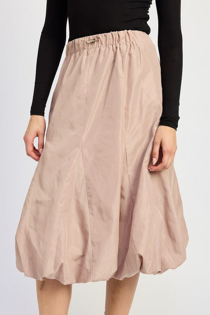 Jade Icarus parachute bubble midi skirt in vibrant fabric, showcased on a model with a flowing, layered design.