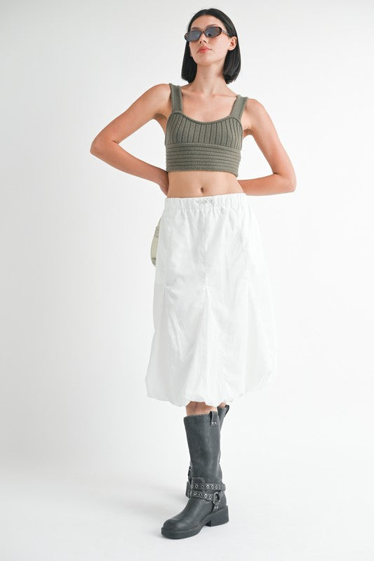 Jade Icarus parachute bubble midi skirt with a lightweight, voluminous design, shown in a fashion photoshoot setting.