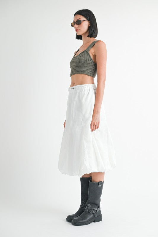 Jade Icarus parachute bubble midi skirt in bright colors, showing flowing fabric and stylish design on a model.