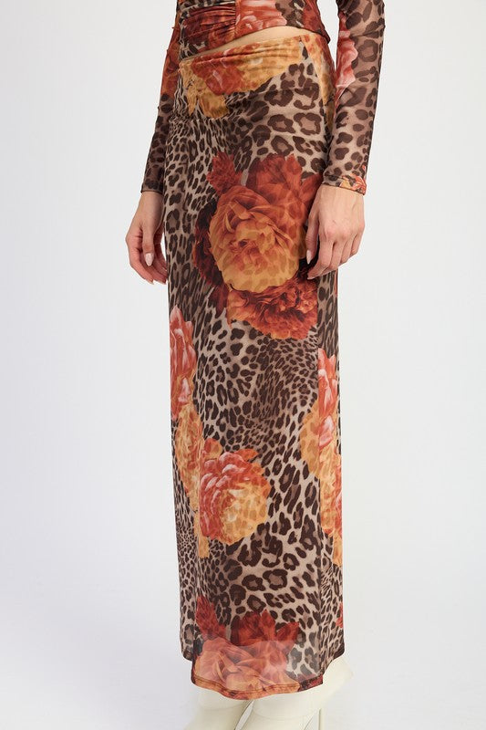 Printed mesh maxi skirt by Jade Icarus featuring a flowing design with bold patterns and lightweight fabric.