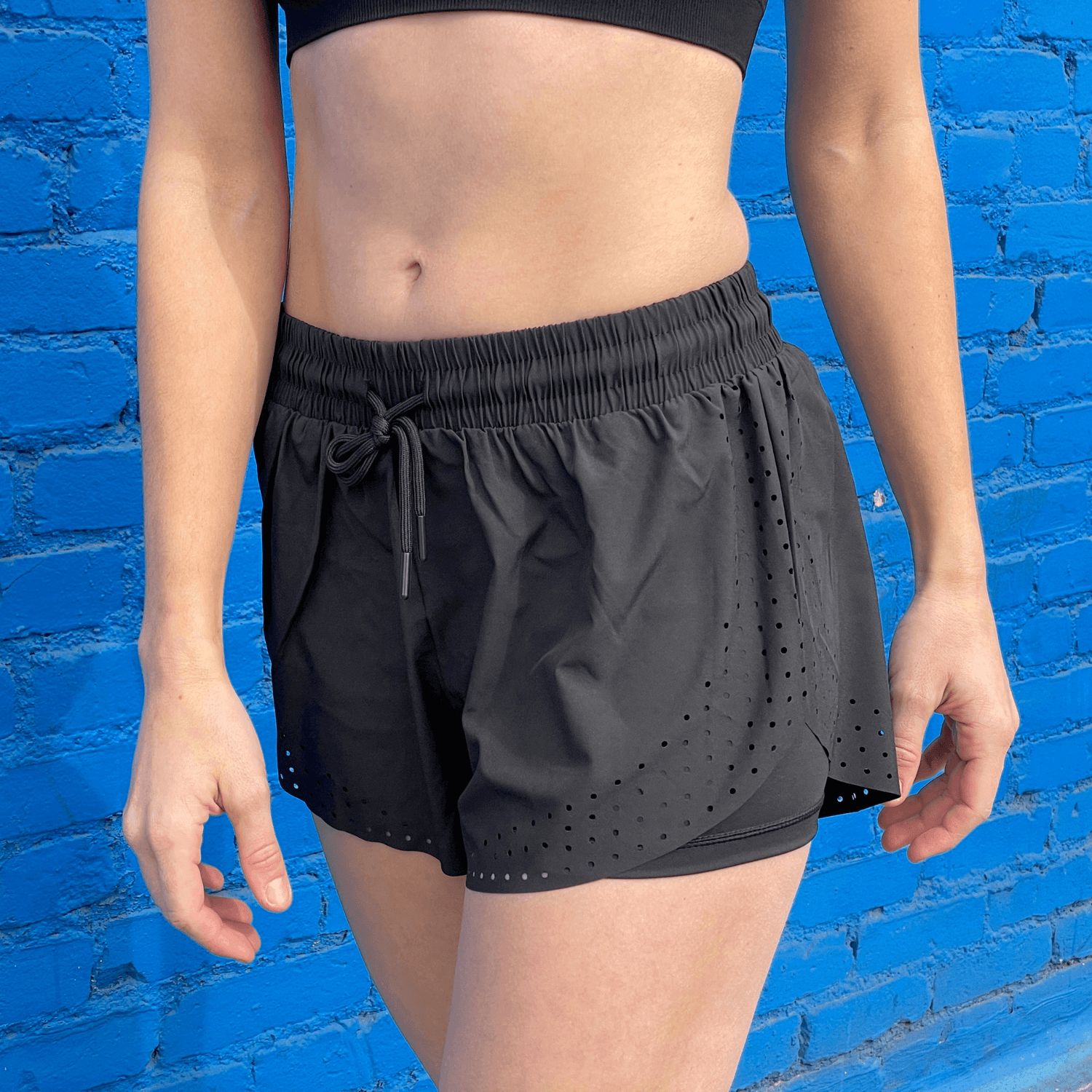 Black Lavender Arielle athletic shorts with built-in compression, featuring a sleek design and comfortable fit for activewear.